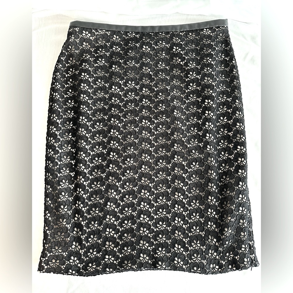 DVF black lace skirt with flesh colored lining. Leather waist band & side zip.